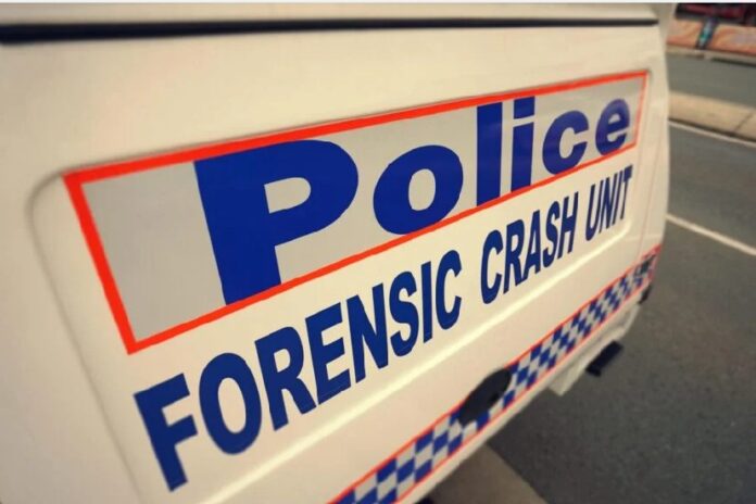 Forensic Crash Unit sign on vehicle.