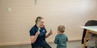 Speech pathologist working with a young child