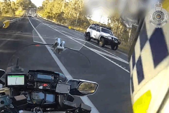 police motorbike and speeding car