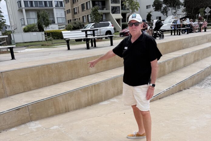 Steve Minton pointing out the dangers of the seawall at Golden Beach.