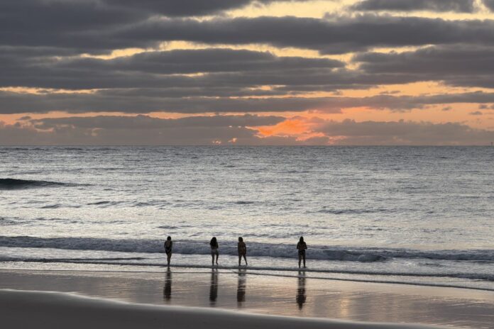 Four swimmers at dawn, Kings Beach