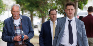 The father of Sam Wood, Andrew Wood (left), barrister David Cole (back right) and lawyer Mathew Cuskelly (front right) are seen approaching Maroochydore Magistrates Court on Thursday. Picture: AAP Image/Russell Freeman.