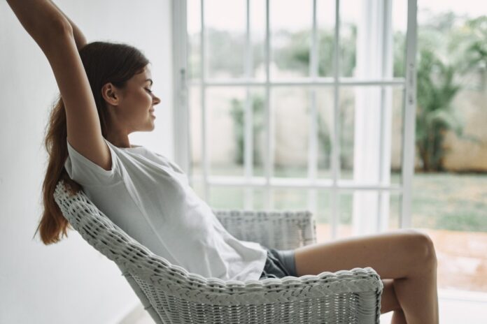 woman relaxing in chair shutterstock