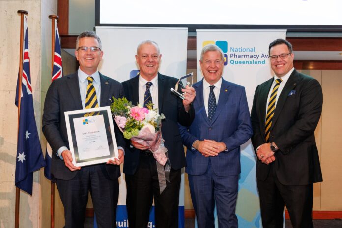 Pharmacy Guild of Australia president Professor Trent Twomey,Tim Fitzpatrick, accepting the award on behalf of his son Sean, Minister for Health and Ambulance Services Tim Nicholls and Pharmacy Guild of Australia, Queensland, president Chris Owen