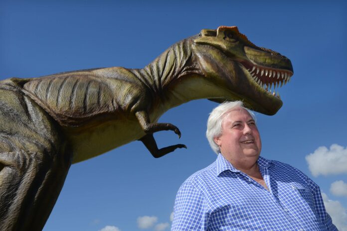 Clive Palmer with one of the more than 160 life-sized dinosaurs he brought to Coolum.